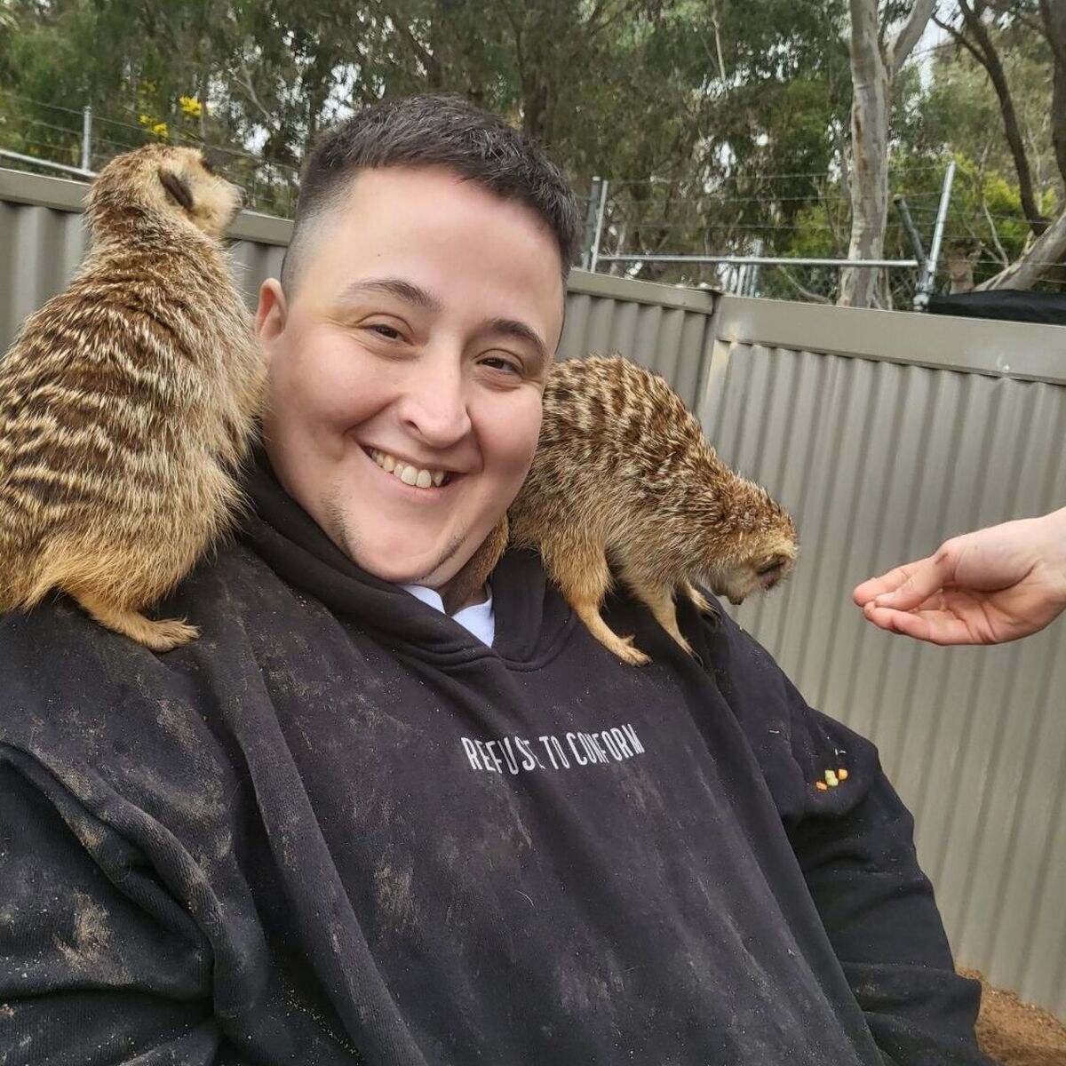 InLife client Ki Hayward with meerkats at the Ballarat Wildlife Park.